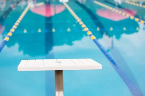 Empty diving block looking down pool race lane - horizontal Stock Photos