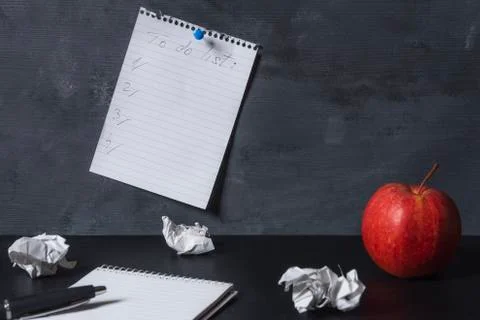 Empty to do list pinned to a wall above a desk Stock Photos