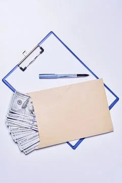 Empty document and pile of money in the envelope Stock Photos