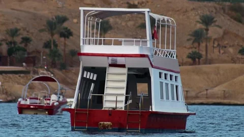 Empty Double Decker Tourist Boat, Twin Hull Passenger marine vessel is rocking Stock Footage 306364126