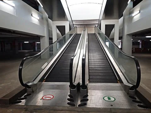 Empty double escalator inside the building Stock Photos