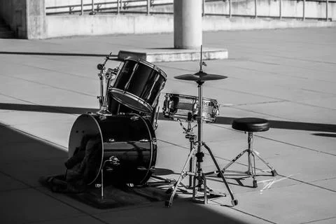 Empty drum kit on concrete in black and white Stock Photos