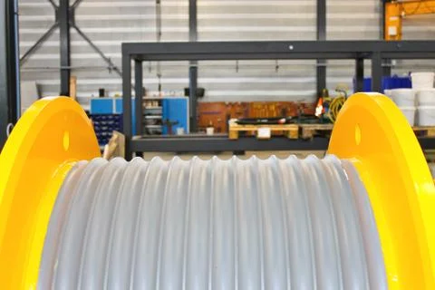 Empty drum for winding wire in the workshop Stock Photos