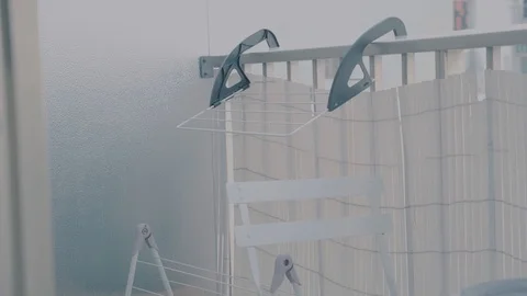 Empty drying rack on a balcony Stock Footage 98368513