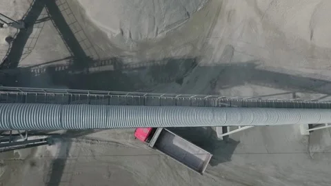 Empty dump truck drives through an industrial area Stock Footage 202068092