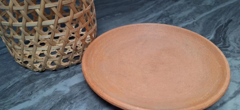 Empty earthen plate  . Stock Photos