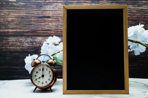 Empty Easel Space copy for text with Blooming Flowers on wooden background Stock Photos