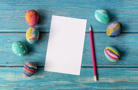 Empty Easter card and Colorful Easter eggs. Easter festive holidays concept. Stock Photos