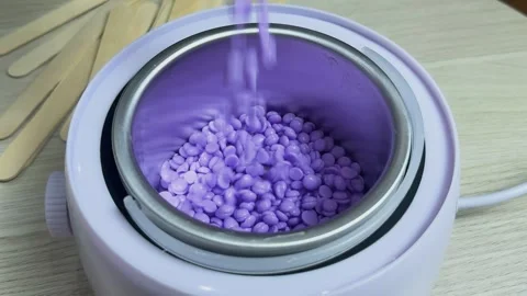 Empty electric wax warmer with a metallic bowl ready for melting wax beads, Stock Footage 330113243