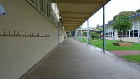 Empty Elementary School Walking Down Hallway POV Stock Footage