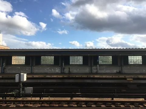 Empty elevated subway platform in New York City. Vacant overground subway sta Stock Photos