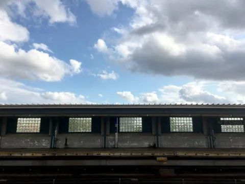 Empty elevated subway platform in New York City. Vacant overground subway sta Stock Photos