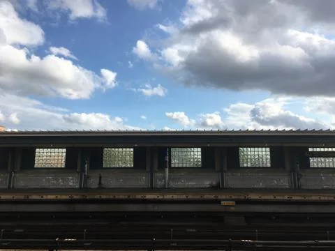 Empty elevated subway platform in New York City. Vacant overground subway sta Stock Photos
