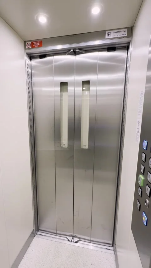 Empty elevator or lift travelling up with doors opening, vertical video Stock Footage 320468800