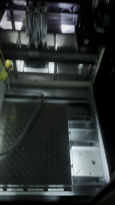 Empty elevator or lift travelling up, the view into the shaft. Vertical video Stock Footage 339096362