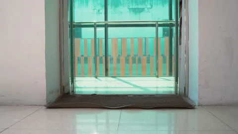 Empty elevator in a residential building or office. The elevator doors open. Stockbeeldmateriaal 155479758