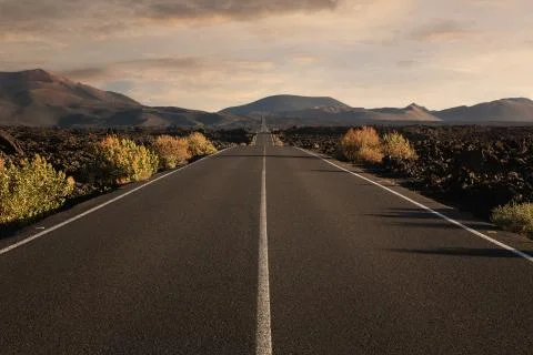 Empty endless highway through the volcanic landscape with copy space Stock Photos