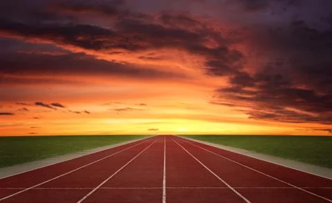 Empty endless running track at the sunset Stock Photos