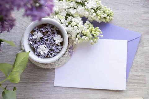 Empty envelope copy space paper note with Tasty black tea in white cup on Stock Photos