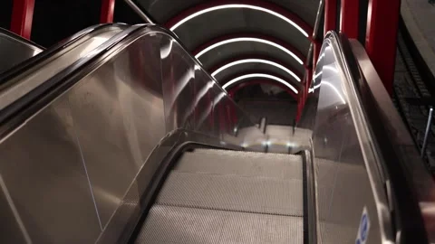 Empty escalator at evening railway station with modern lights and clean urban de Stock Footage 323265862