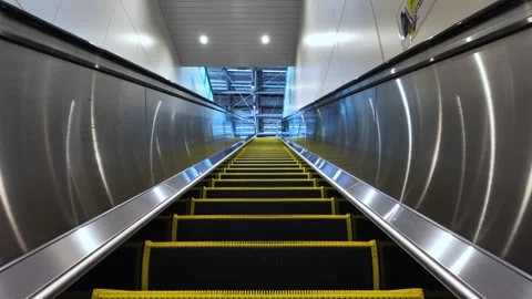 Empty escalator going up in modern building from passenger point of view Stock Footage 309616863
