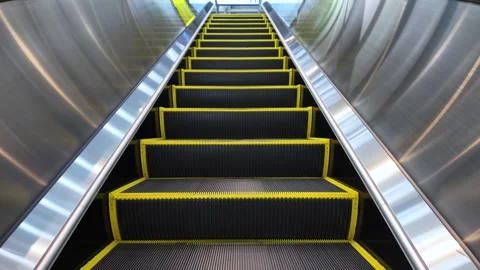 Empty escalator going up in a modern building Stock Footage 309617123