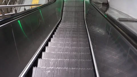 Empty escalator in modern underground station with metallic reflections Stock Footage 321003559