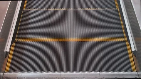 The empty escalator moves down. Stock Footage 233617119
