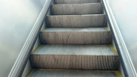 Empty escalator stairs moving up and dip in white light on the top. Stock-Footage 163219567