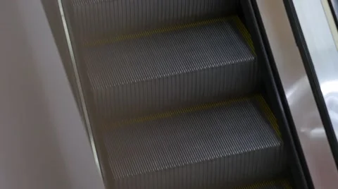 Empty escalator steps going down Stock Footage 64093649