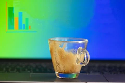 Empty espresso cup on laptop with break message on screen Stock Photos