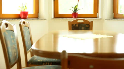 Empty family kitchen table with six chairs by the windows Stock Footage 24152453