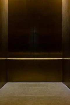 Empty Fancy Elevator Carriage Metal Pole Inside Metal Box Interior Closed E.. Fotos de archivo