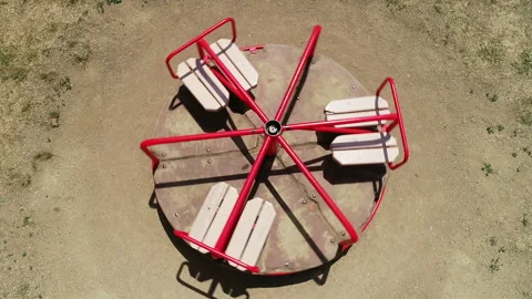 Empty fast spinning red children's carousel in the playground, top view Stock Footage 146168204