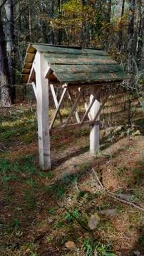Empty feeder for wild animals in the forest 库存照片
