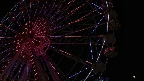 Empty Ferris Wheel Rotating in Amusement Park at Night Stock Footage 280715111