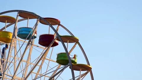Empty ferris wheel without people spinning at daytime. Stock Footage 137162764