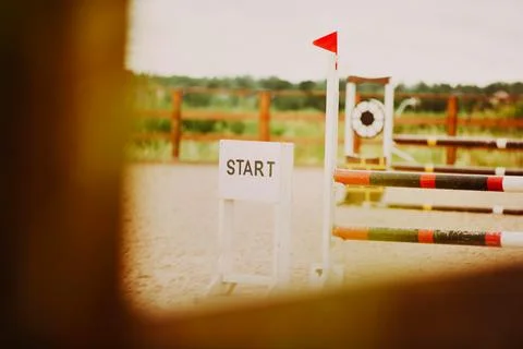 An empty field for equestrian show jumping competitions on a summer day. A hi Stock Photos