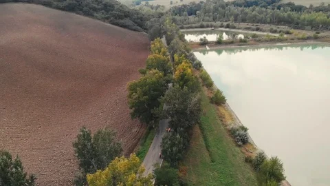 Empty fields and a lake Stock Footage 114769423