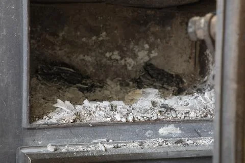 Empty fireplace with a lot of ash inside Stock Photos