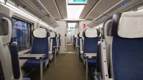 Empty first class train interior with comfortable blue seats and tables Stock Footage 334732115