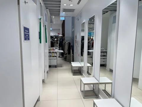 Empty fitting rooms. Interior of a modern clothing store. Stock Photos