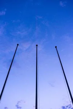 Empty flag post low angle view in blue hour night abstract architecture Stock Photos