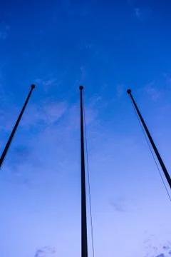 Empty flag post low angle view in blue hour night abstract architecture Stock Photos