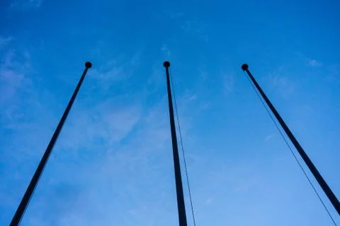 Empty flag post low angle view in blue hour night abstract architecture Stock Photos