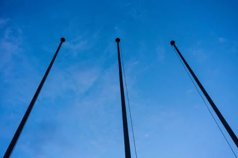 Empty flag post low angle view in blue hour night abstract architecture Stock Photos