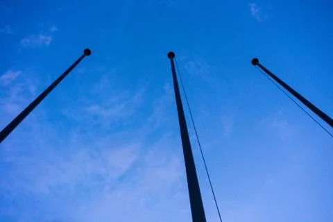 Empty flag post low angle view in blue hour night abstract architecture Stock Photos