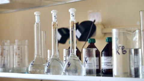 Empty flasks and vessels on a laboratory shelf. Stock Footage 127321400