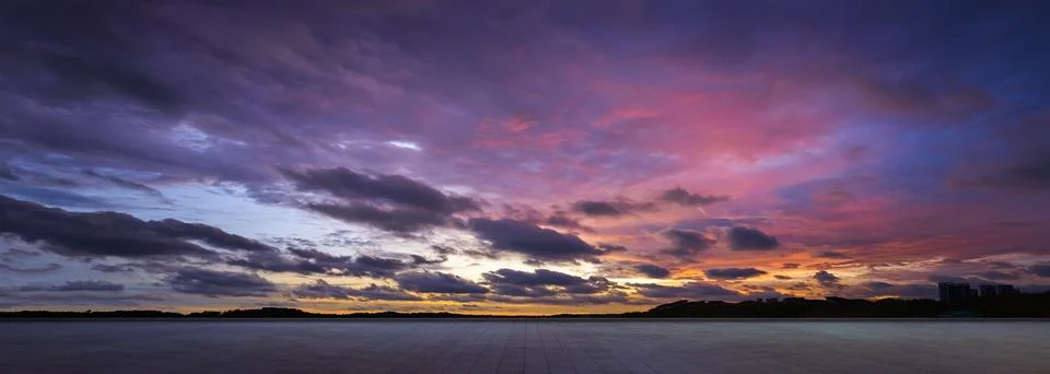 Empty floor with dramatic suset sky Stock Photos