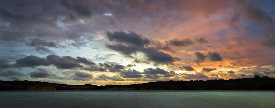 Empty floor with dramatic suset sky Stock Photos